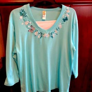 Woman’s 3/4 sleeve embellished top.